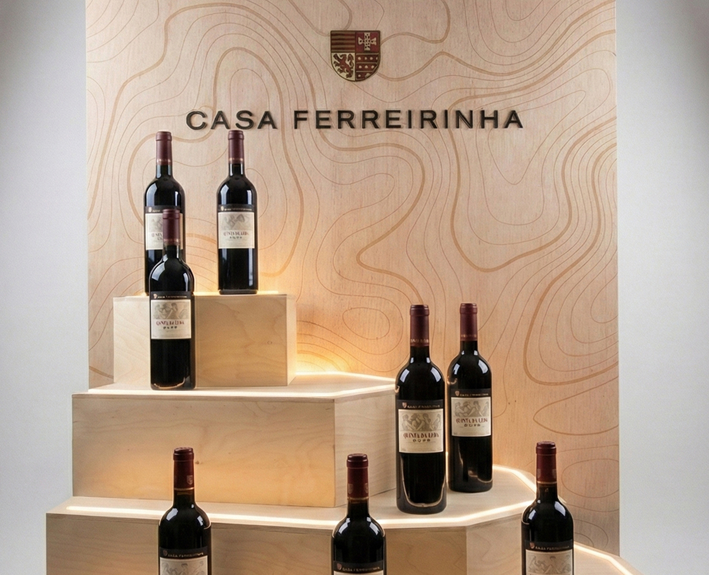 Casa Ferreirinha bottle displays evoking the Douro terraces, with LED neon — Sogrape, Woodini and Polvo Criativo Oficina